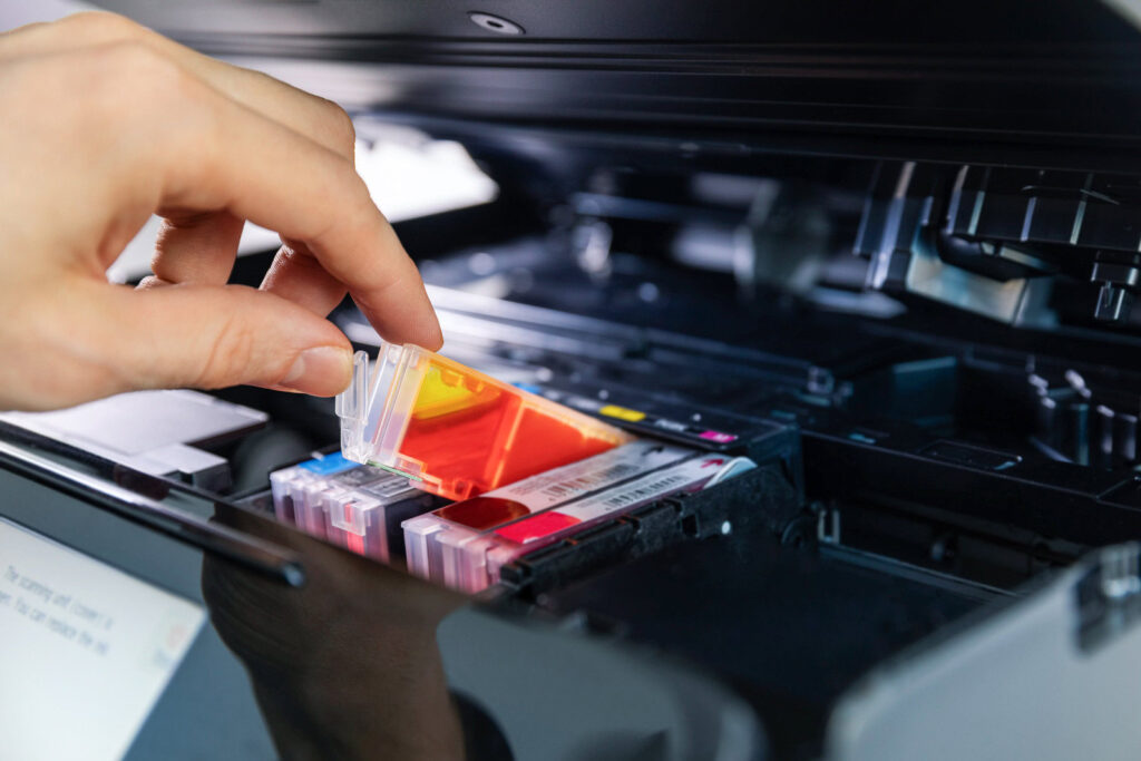 office equipment maintenance and service hand replace inkjet printer cartridge