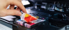 office equipment maintenance and service hand replace inkjet printer cartridge